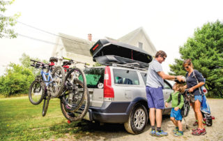 Family with Vehicle Cargo Box and Bike racks